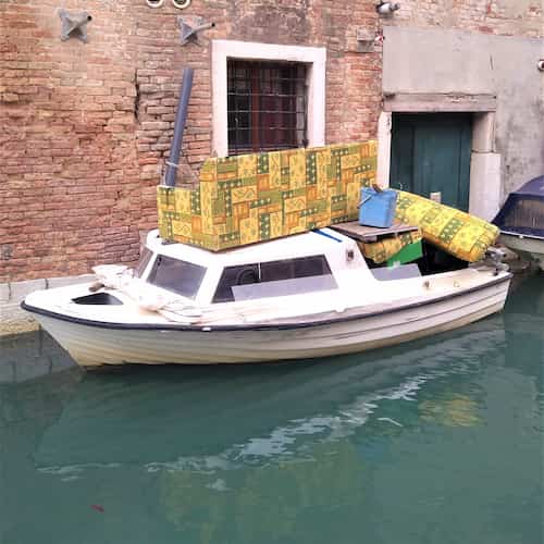 boat with sofa on top